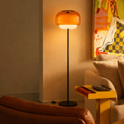Golvlampa med rosa glasskärm och stålfot